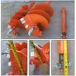 WIG auger bits in orange with carbide teeth and the 36in extension shaft, tape-measured for size