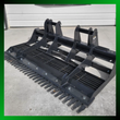 Wolverine 72-inch land leveler planer, black metal with multiple tines for skid steers