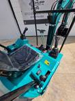 CFG H16R mini excavator cab, teal seat and dual joystick controls