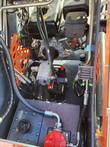 AGT YSRT14 engine bay with the gasoline engine, battery, silver hydraulic gear pump and red fuel cap