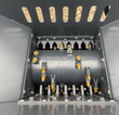 Inside the WIG block crusher hopper: carbide-tooth crushing rotor and breaker teeth above the discharge slots