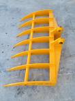 Yellow excavator root rake, seven curved tines on a tubular frame with twin pin-boss mounting ears