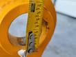 Tape measure across the Future 46-inch excavator rake's mounting pin bore