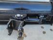 Back of the tilt bucket: center pivot bolt, hydraulic tilt cylinder and pinned twin-ear mounting bracket