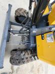 AGT H15 backfill blade and lift cylinder ahead of the rubber tracks, AGT data plate on the yellow body