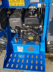 AGT mini skid steer engine bay: 420cc gasoline engine with recoil start and air cleaner, over a perforated step