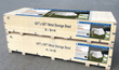 Two stacked plywood shipping crates holding the 42x30 metal storage shed kit, labeled A and B