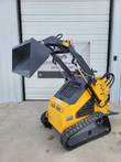 ZJG-380 mini skid steer with bucket raised, rubber tracks, stand-on rear platform and auxiliary hydraulic lines