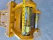 Tape measure along the breaker's mounting-bracket pin and bronze bushings, reading past eight inches