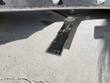 54-inch brush cutter's cutting blade bolted beneath the rotor bar