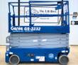Blue Genie GS-3232 electric scissor lift with platform lowered, control box on the rail and solid tires