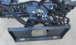 Arteer soil conditioner top view: hydraulic valve block, hoses, and skid steer mounting plate