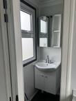 Bathroom vanity sink with cabinet, mirrored medicine cabinet with side shelves and frosted window