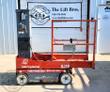 Skyjack SJ16 vertical mast lift in red, gray mast at the rear, guardrailed platform, control box on the mast