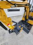 AGT H15 boom and stick with the digging bucket and thumb, backfill blade and rubber track alongside