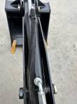 Landhonor backhoe hydraulic cylinder, hose and bucket teeth, close-up
