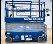 Blue Genie GS-3232 scissor lift with platform lowered and the upper control box mounted on the guardrail