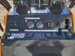 ATS-T460 mini skid steer dash panel: oil temperature and hour meter gauges, lamp/horn switch, ignition, throttle
