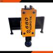 AGROTK 680 post driver: yellow decal panel, black post cap at the base, hydraulic ports on top, mount frame behind