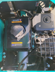 QK16R mini excavator engine bay from above: fuel tank cap, air cleaner, oil cooler and muffler guard