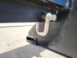 Screw-pin D-shackle pinned through a lug on the forklift jib's mounting frame