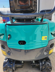 QK16R mini excavator from the rear, engine hood raised over the counterweight and rubber tracks