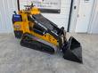 CFG Industrial KJT27 mini skid steer, yellow, tracked, loader bucket lowered to the ground