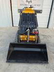 CFG Industrial KJT27 loader bucket tipped forward, with dual rubber tracks
