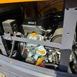 MX20R gas engine and fuel tank cap inside the open engine bay
