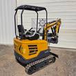 CFG Industrial MX20R mini excavator, rear three-quarter view with arm and thumb bucket extended