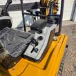 MX20R operator console: ignition key switch, throttle knob, and joystick armrest
