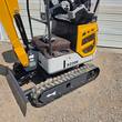 CFG XZ20R mini excavator rear end: quilted seat, mesh-vented engine cover, dozer blade and rubber tracks