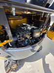 CFG QK18R mini excavator engine, air filter, and muffler in the open engine bay