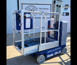 Genie GR-20 vertical mast lift, blue base on wheels, aluminum platform with guardrails and control box