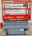 Skyjack SJIII 3219 scissor lift, platform lowered, front view, tag MC