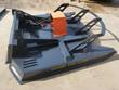 Gray 72-inch brush cutter deck from above: open cutting front, orange motor cover, guard bars and rear push hoop