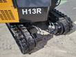 AGT H13R decal on the rear body above the rubber tracks and their hydraulic drive motors