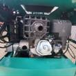 AGT MH12RX engine bay: OHV gasoline engine with air cleaner and carburetor, hydraulic pump and lines in the teal shroud