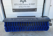 Arteer skid steer angle broom, blue poly bristles, front view of roller housing