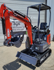 Orange and gray MX15RX mini excavator with canopy, digging bucket and thumb, backfill blade