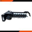 Wolverine trencher attachment, side profile: black boom, toothed digging chain, spoil auger, skid steer mount plate