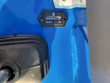 Hour meter reading 0.6 hours on the machine's blue panel, beside a rubber control boot