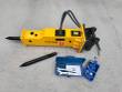 TOFT530 yellow hydraulic breaker with moil point fitted, spare chisel, wrench box and blue charge kit