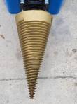 Gold screw cone from above, helical thread tapering to a sharp point over the motor assembly