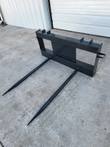 JCT double hay bale spear: black skid steer quick-attach frame with two long tapered tines pointing forward