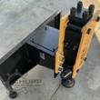 AGROTK 680 post driver on its skid steer mount frame, hydraulic quick-couplers along the side, post cap at the base