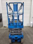 Genie GS-2632 scissor lift, platform lowered, rear view, tag G166
