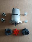 Gear pump with lovejoy coupler hubs, red spider insert and four port fittings laid out