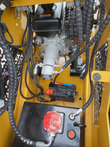 AGT MX-MRT14 mini skid steer engine bay: gas engine, hydraulic pump, battery and hydraulic tank with red cap