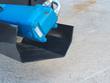Blue hydraulic orbit drive motor bolted to the end of the Mower King tiller, steel line and black rotor end plate